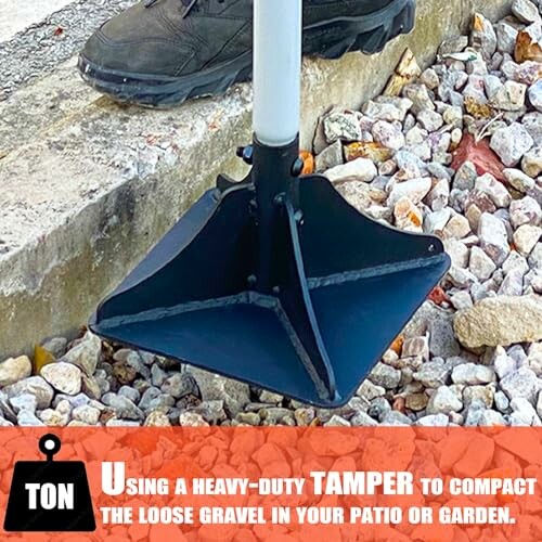 Heavy-duty tamper tool compacting gravel.