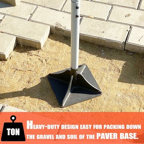 Tamper tool on dirt and paver base.