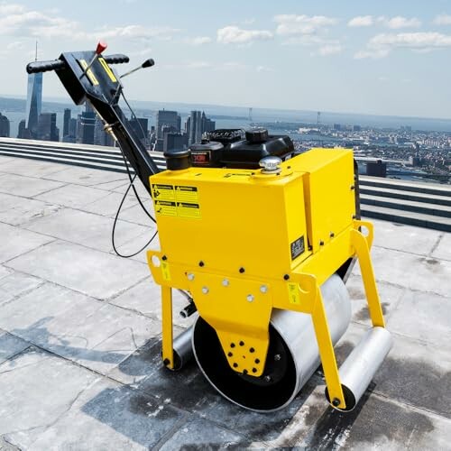 Yellow road roller on a rooftop with cityscape background